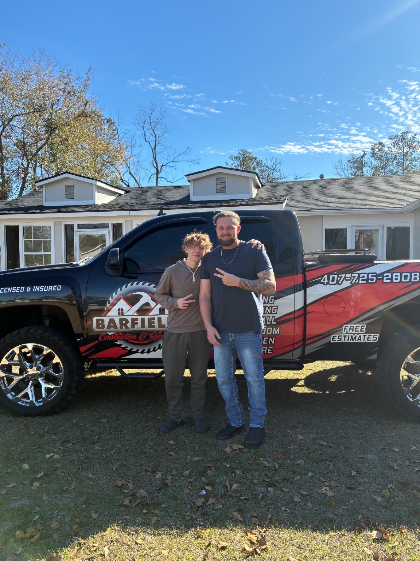 Barfield Construction owner and son in front of company truck